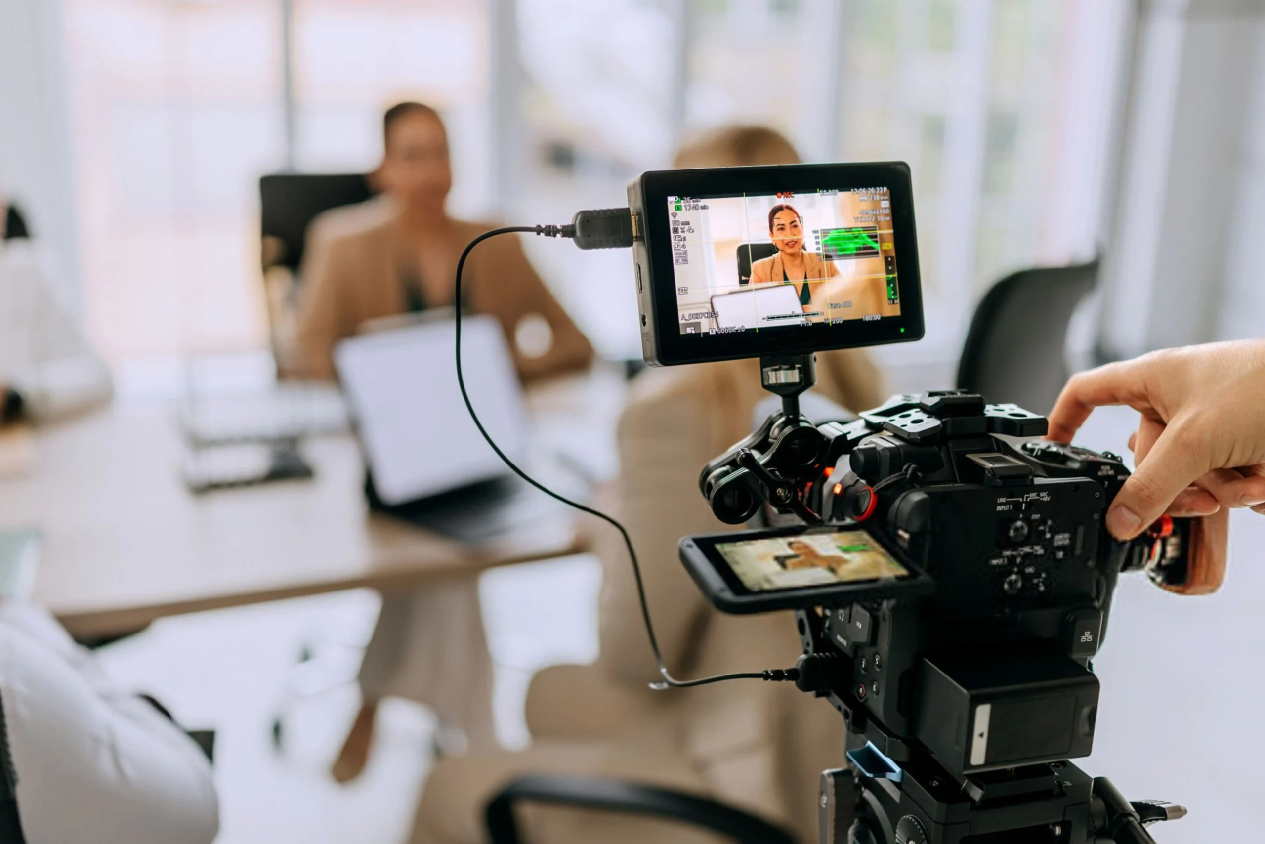 839bef52-6f6e-47e8-8f4b-b40528d83398-Successful business team discussing strategy while filming s