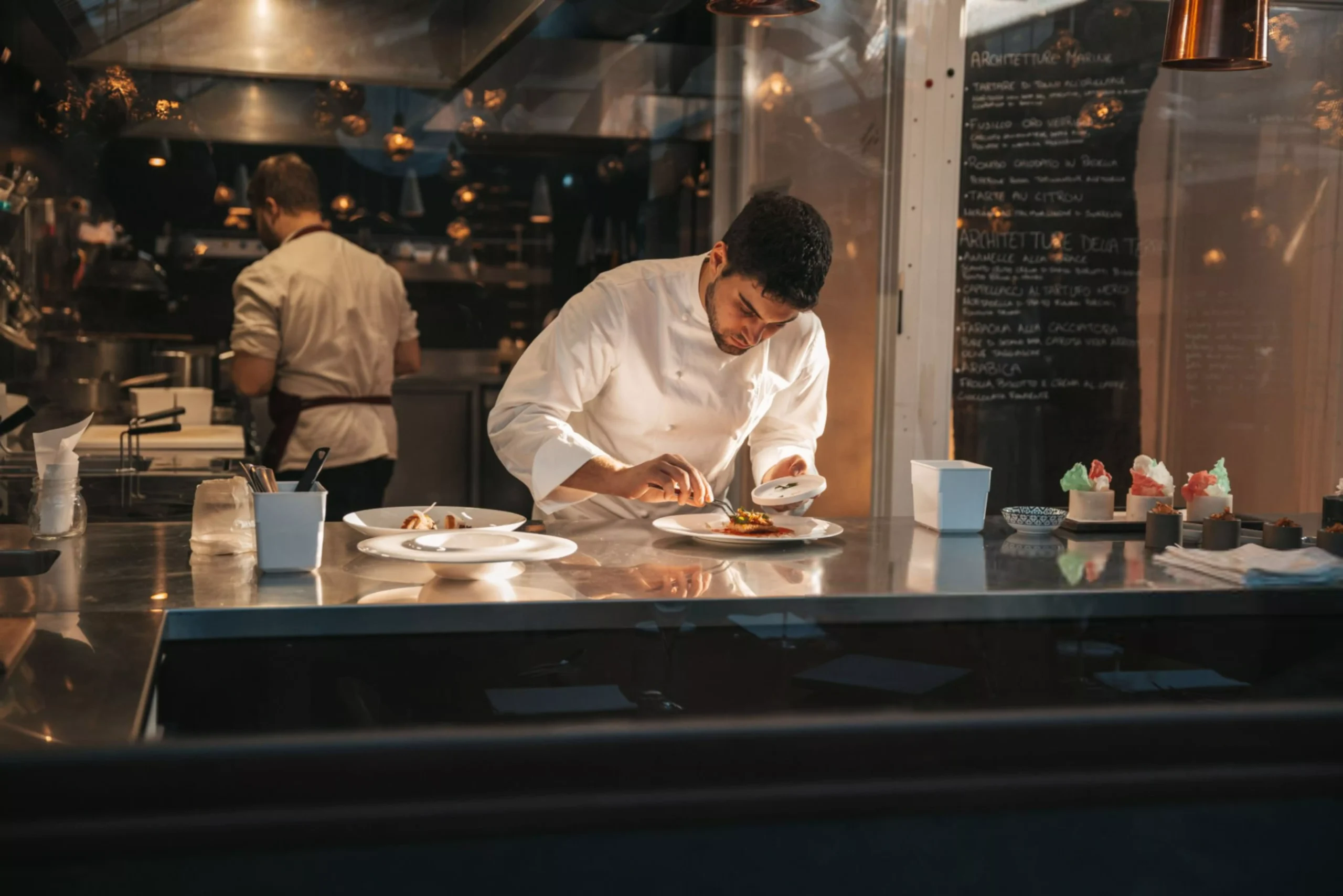 Chef preparing a plate in a gourmet restaurant