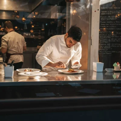 Chef preparing a plate in a gourmet restaurant