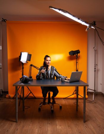 famous-creative-woman-recording-podcast-home-studio-min